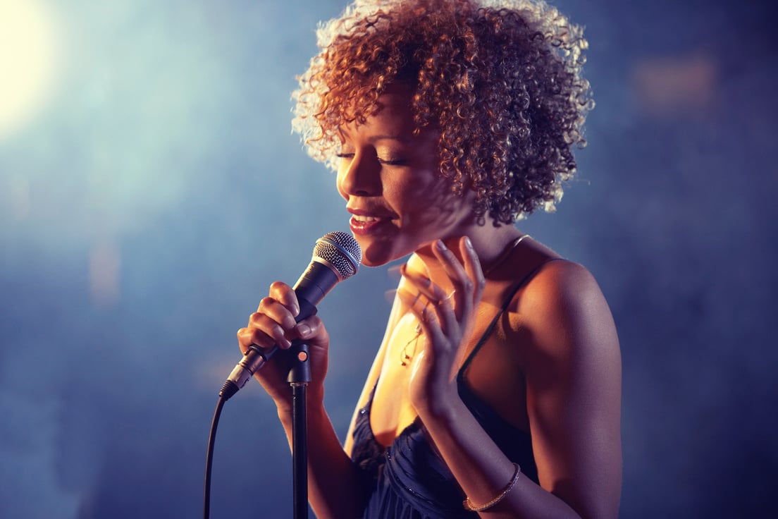 Black female Singer Performing on stage